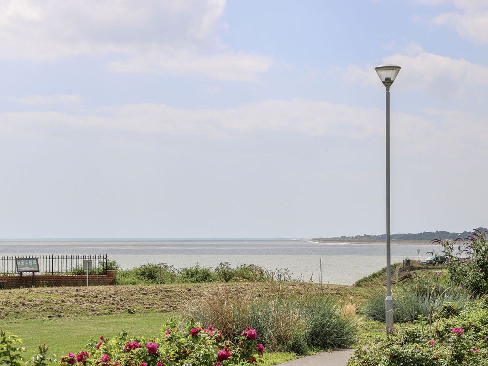 A view of the sea with a lamp post and flowers at Sunrise House in Pakefield near Lowestoft