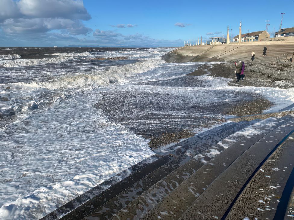 A beach with waves and steps at 26 North Promenade Cleveleys