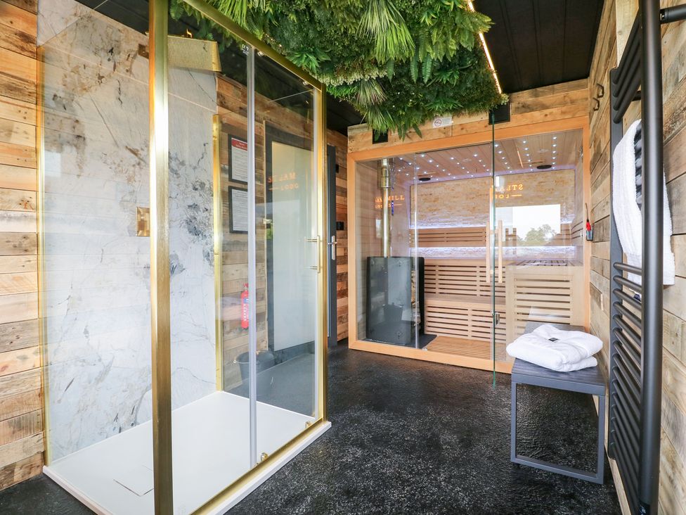 A bathroom with a shower and sauna at Hazel in Oakthorpe near Donisthorpe