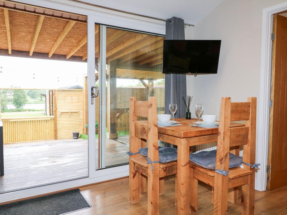 A dining room with a table and chairs at Birch near Oakthorpe