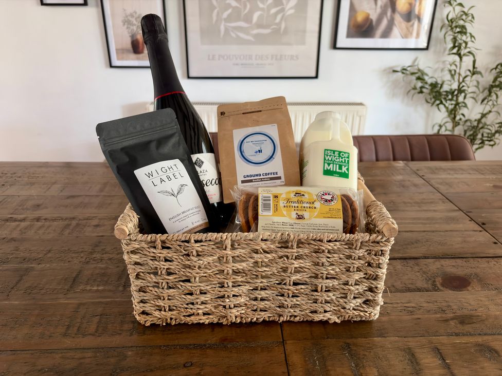 A kitchen display of a basket with food items at Topsails in Totland Bay
