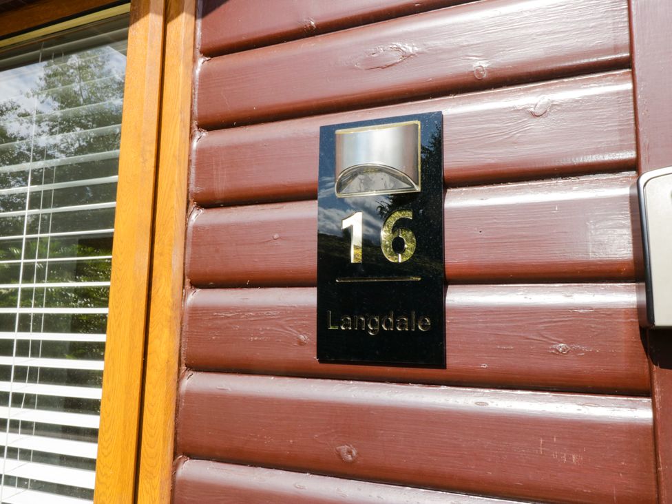 A door with house number 16 and light fixture at Ruskin Lodge, Langdale 16, White Cross Bay near Windermere