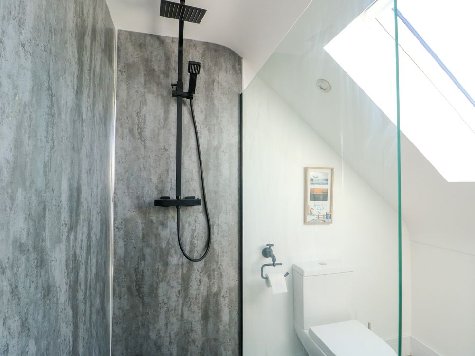 A bathroom with a shower and toilet at Iscoed in Rhosneigr