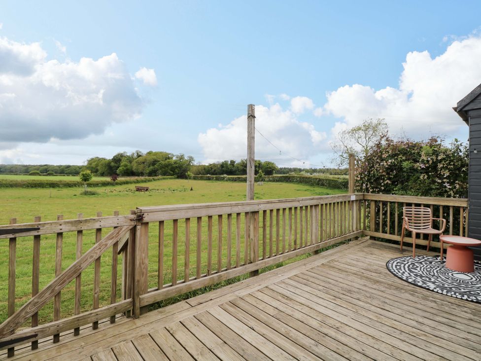 A deck area overlooking a field at Foxglove in King's Lynn