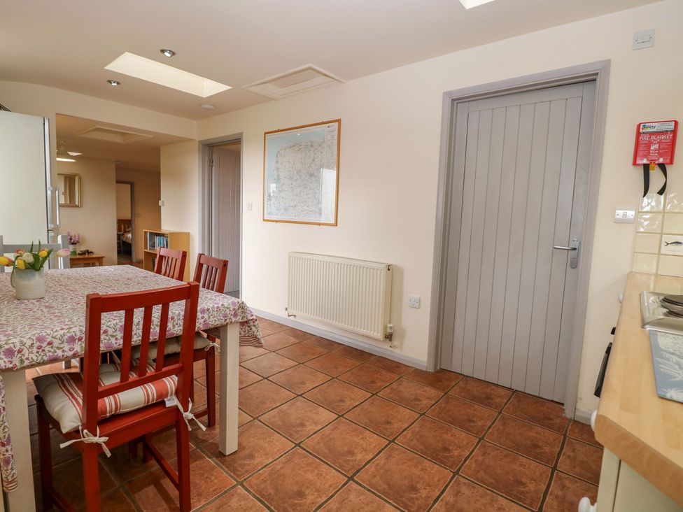 A kitchen with table and chairs at Hollyhock in King's Lynn