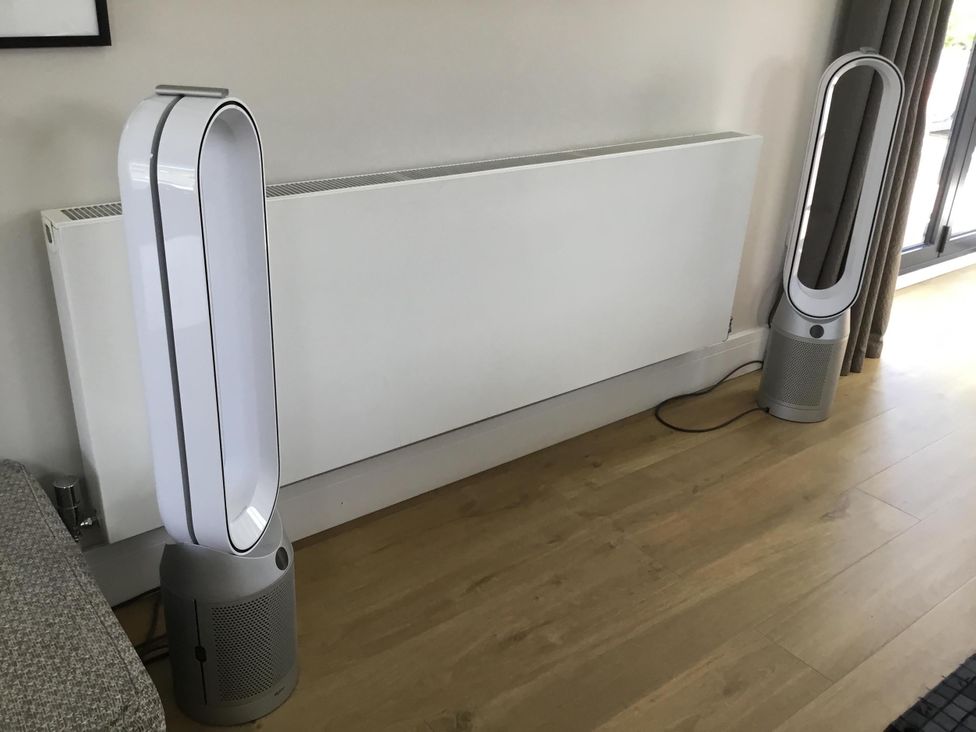 A living room with air purifiers and a heater at Yonder Lea in Bowness-On-Windermere