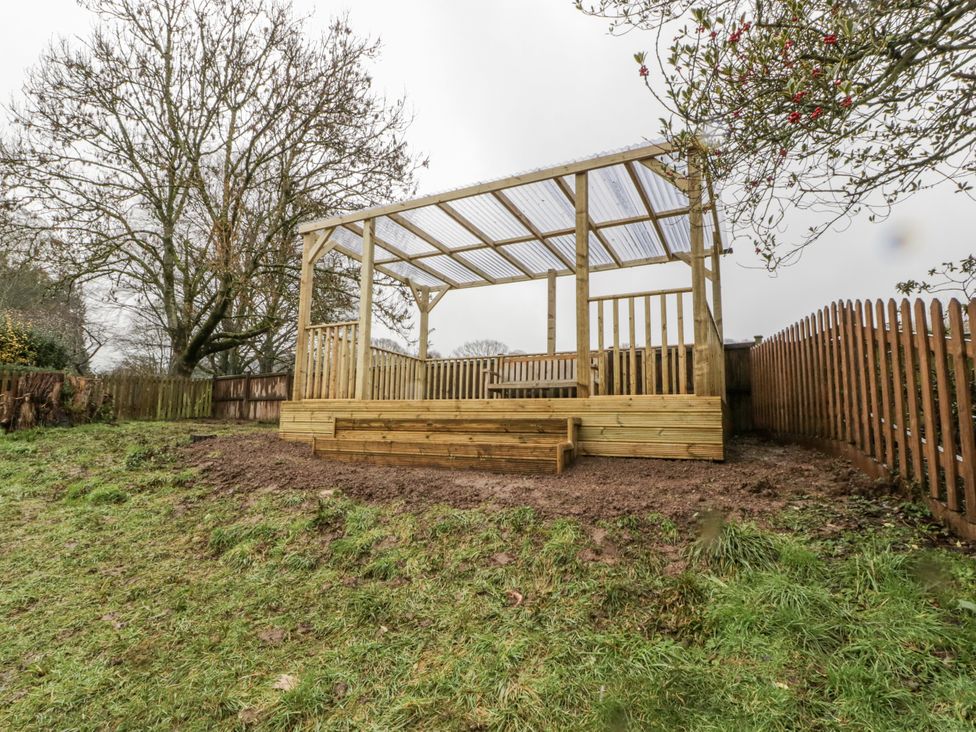 An outdoor wooden structure with a deck at Ranbir House in Longhope