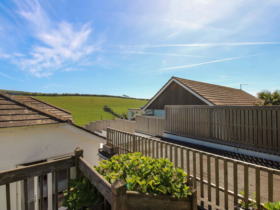 A rooftop view with houses and green fields at Tansea in Hope Cove