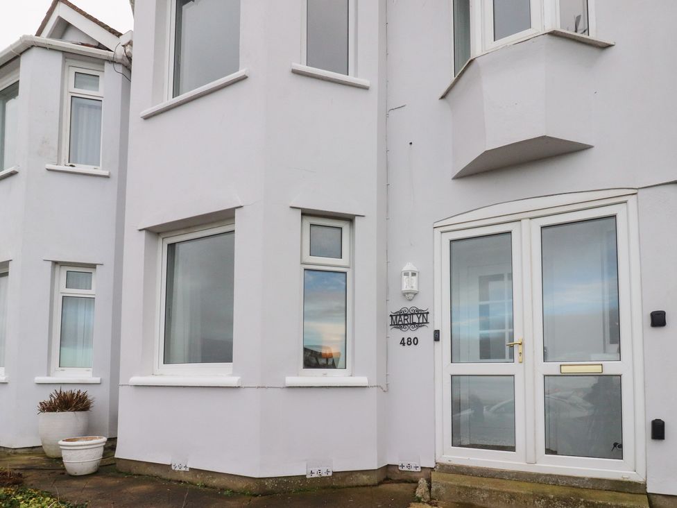 A house facade with windows and a front door at 480 Marine Road East in Morecambe