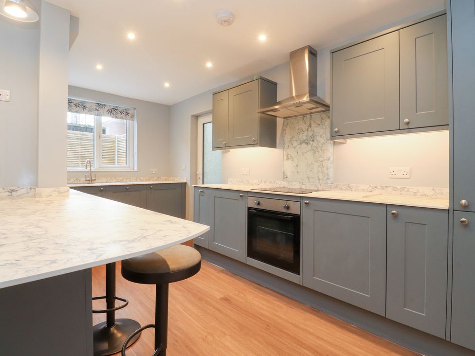 A kitchen with cabinets and an oven at 480 Marine Road East Morecambe