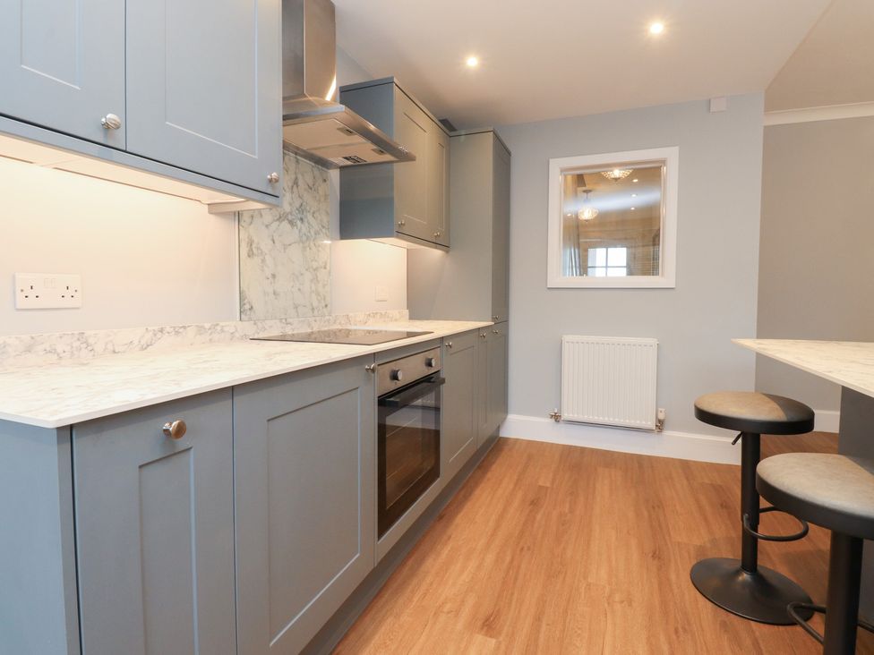 A kitchen with countertop and cabinets at 480 Marine Road East Morecambe