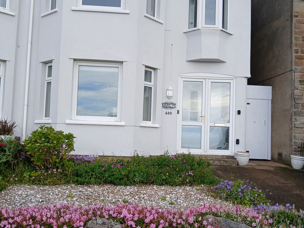 A house exterior with a door and windows at Marilyn in Morecambe