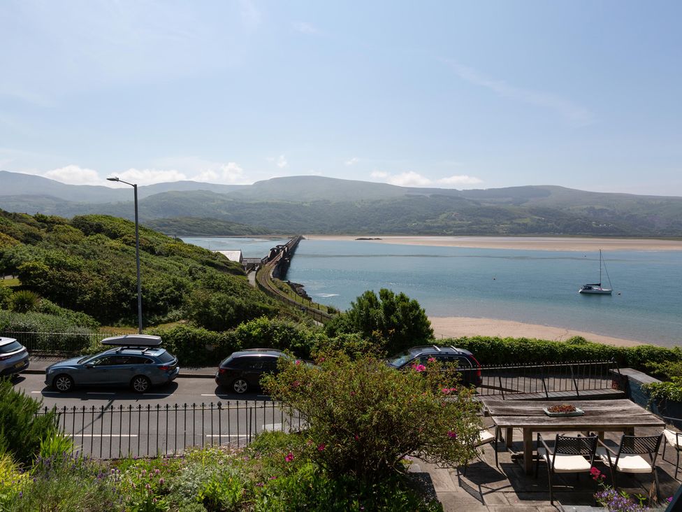 A view of the sea and mountains from an outdoor area at Bod Idris in Barmouth