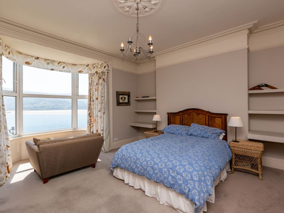 A bedroom with a bed and window at Bod Idris in Barmouth