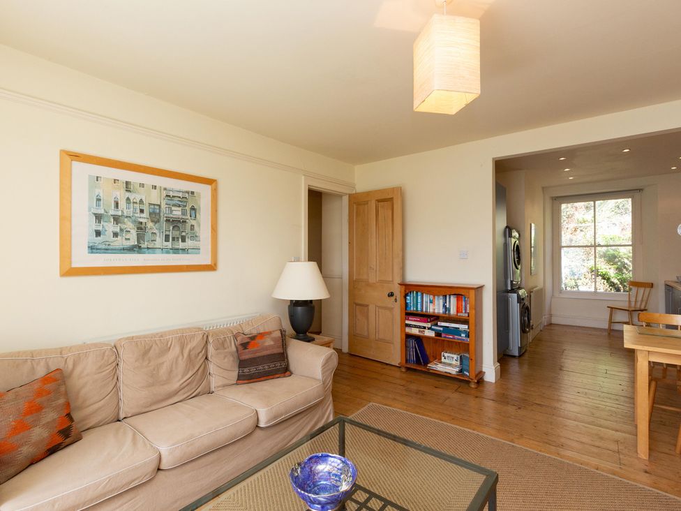 A living room with a sofa and coffee table at Bod Idris in Barmouth