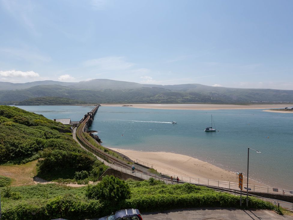 A view of a bridge and boats on water at Bod Idris in Barmouth
