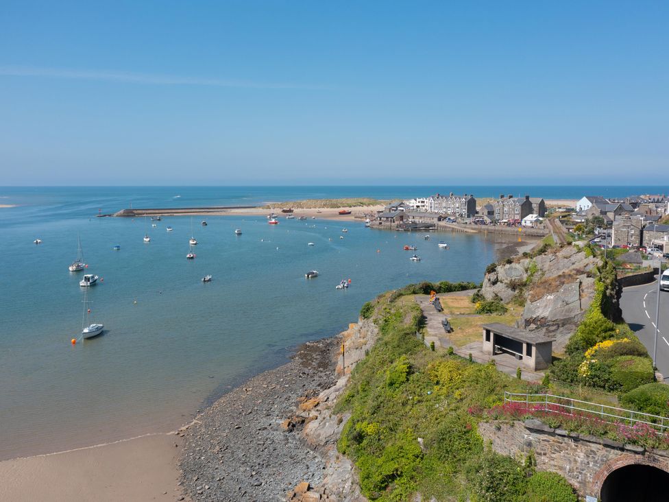 A view of a harbor with boats and buildings at Bod Idris in Barmouth