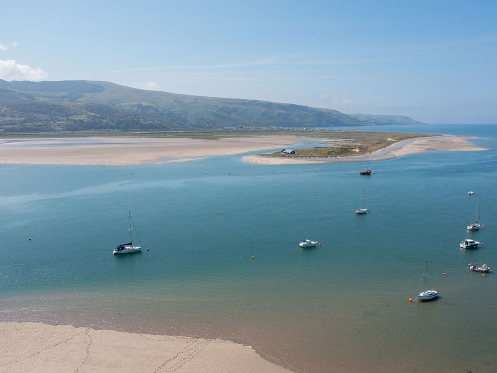 A view of boats in water and sand at Bod Idris in Barmouth