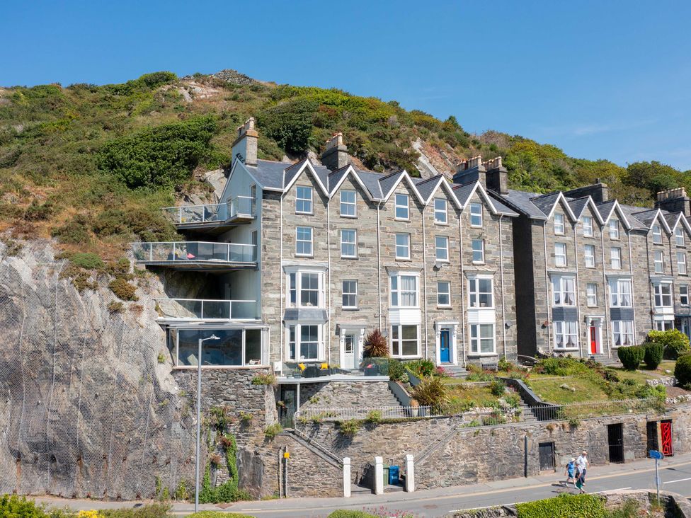 A row of houses with balconies on a hillside at Bod Idris in Barmouth