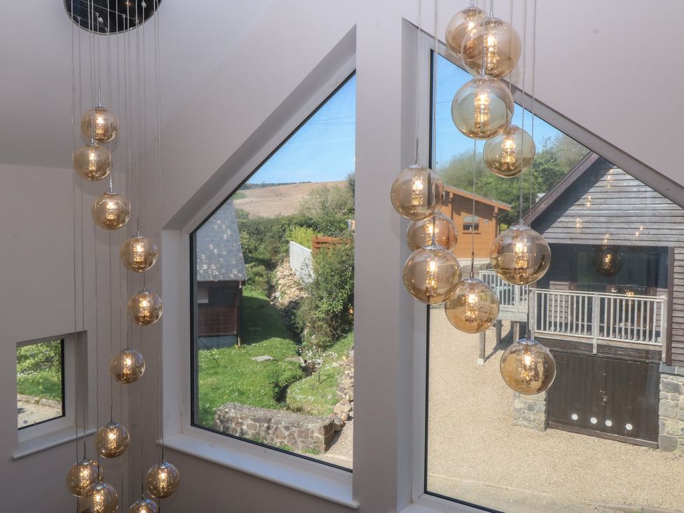 A lighting feature and windows in a property at The Hideaway in Mynytho near Abersoch
