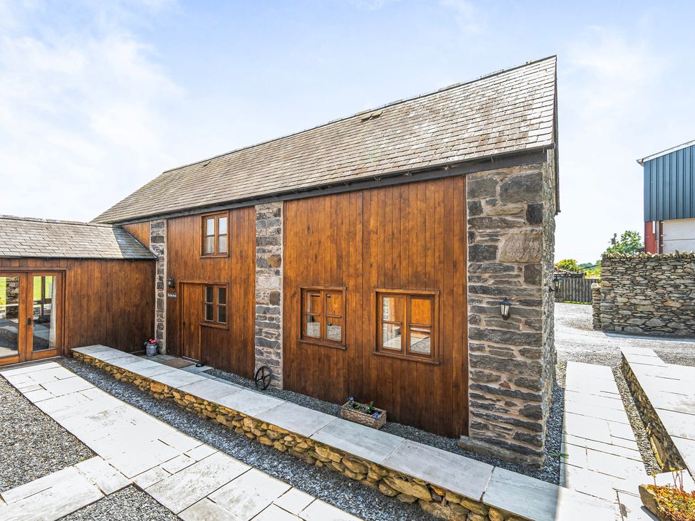 A building with wooden and stone walls at Hay Store in Corwen