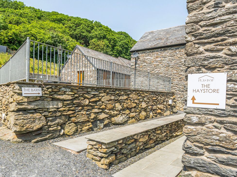 A stone pathway and buildings at The Haystore in Corwen