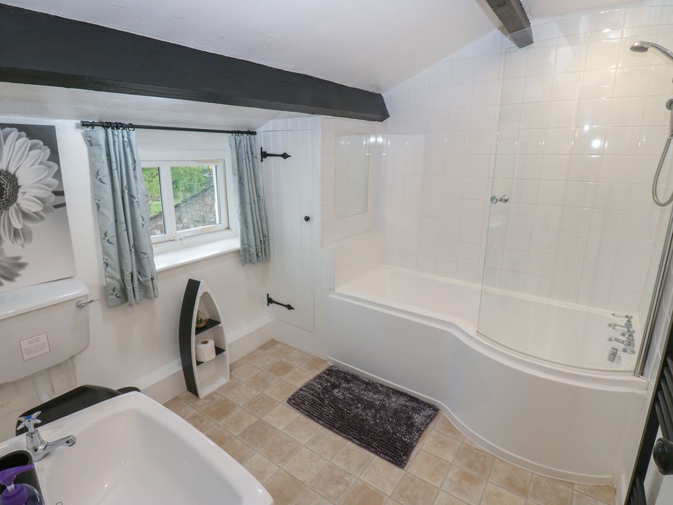 A bathroom with a bath tub and shower at The LA'AL Cragg in Kirkby Stephen
