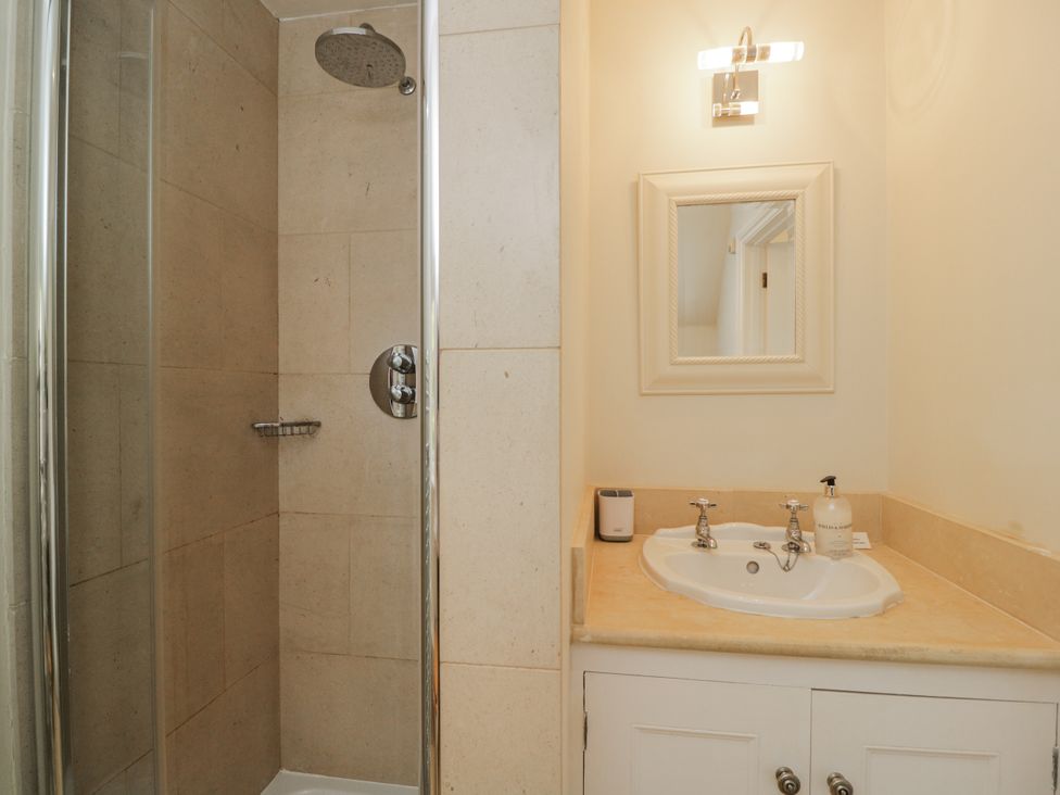 A bathroom featuring a shower and a sink at The Old Hall in Tetbury