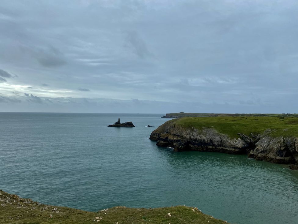 A coastal view with cliffs and rock formations at Tower Cottage Near Pembroke