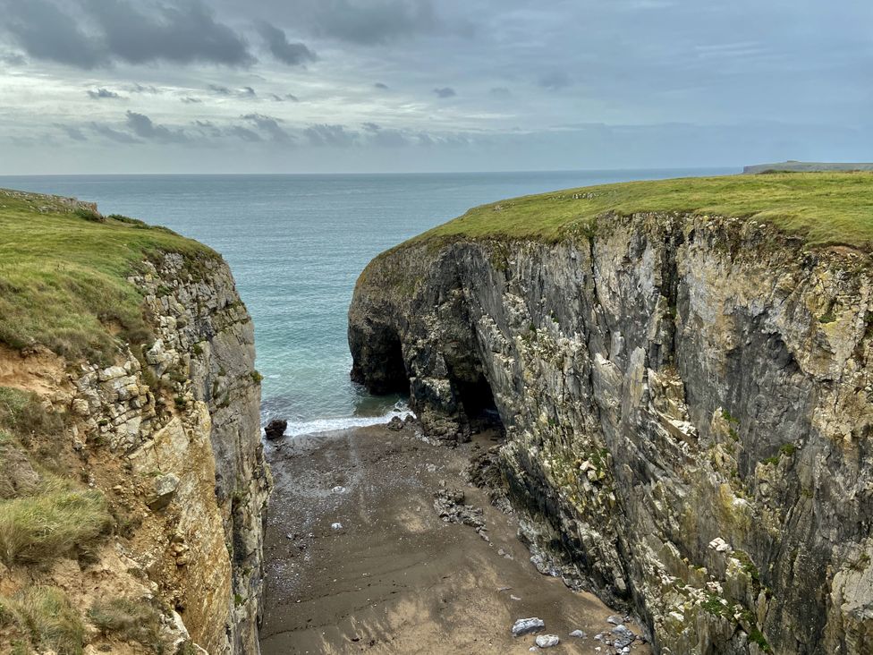 A coastal view with cliffs and ocean at Tower Cottage Near Pembroke