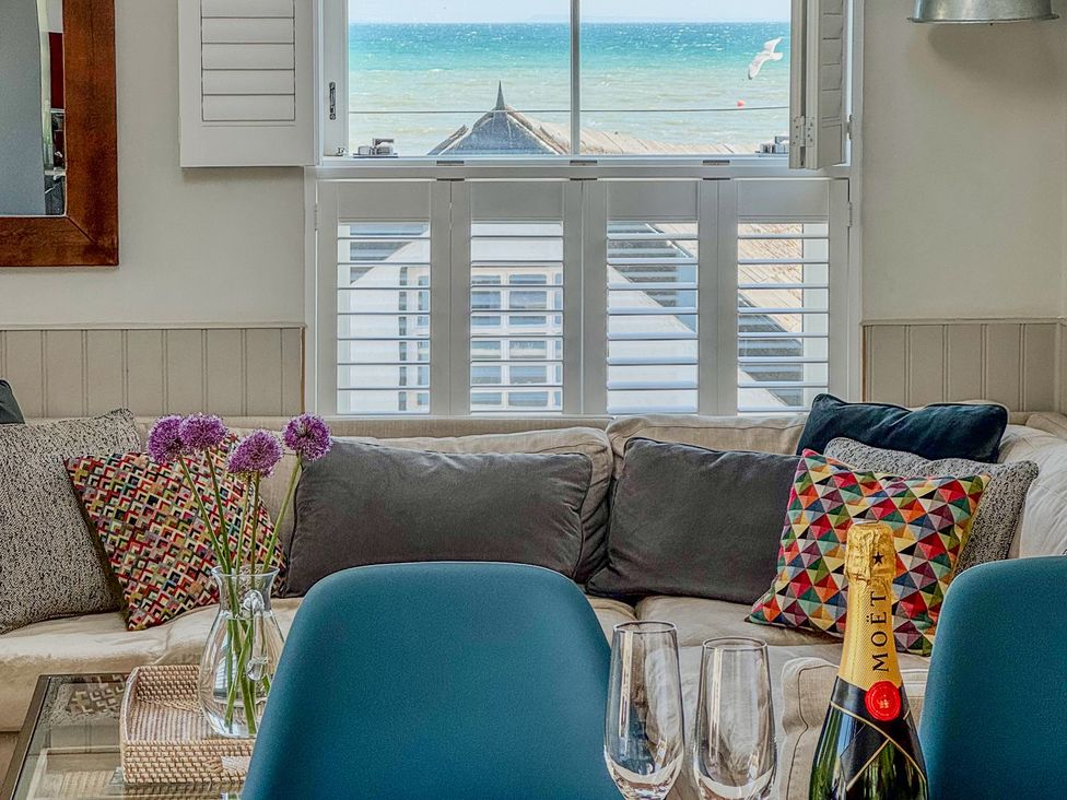 A living room with a view of the sea at Port House in Lyme Regis