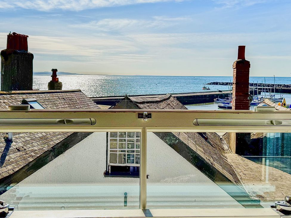 A view of the sea and harbor from a window at Port House in Lyme Regis
