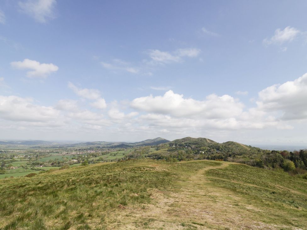 A landscape view of hills and valleys with clouds in the sky at Keepers Barn Bromyard