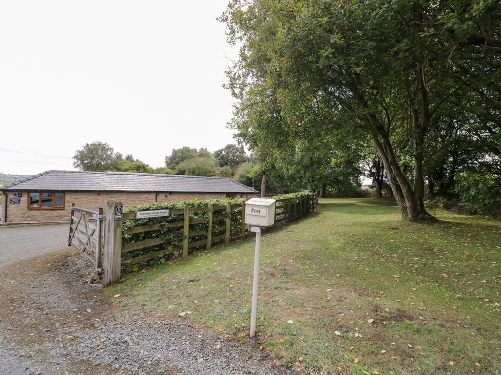 An outdoor view with a building and pathway at The Cow Shed in Bromyard