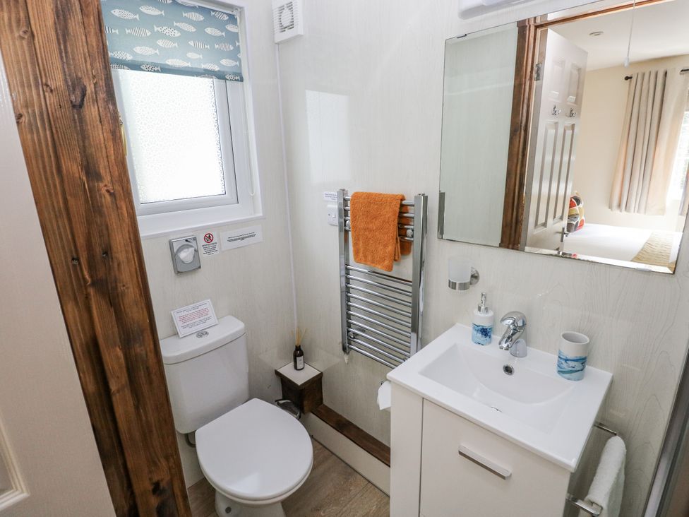 A bathroom with a sink and toilet at Ty Barddu Cwmorgan near Newcastle Emlyn