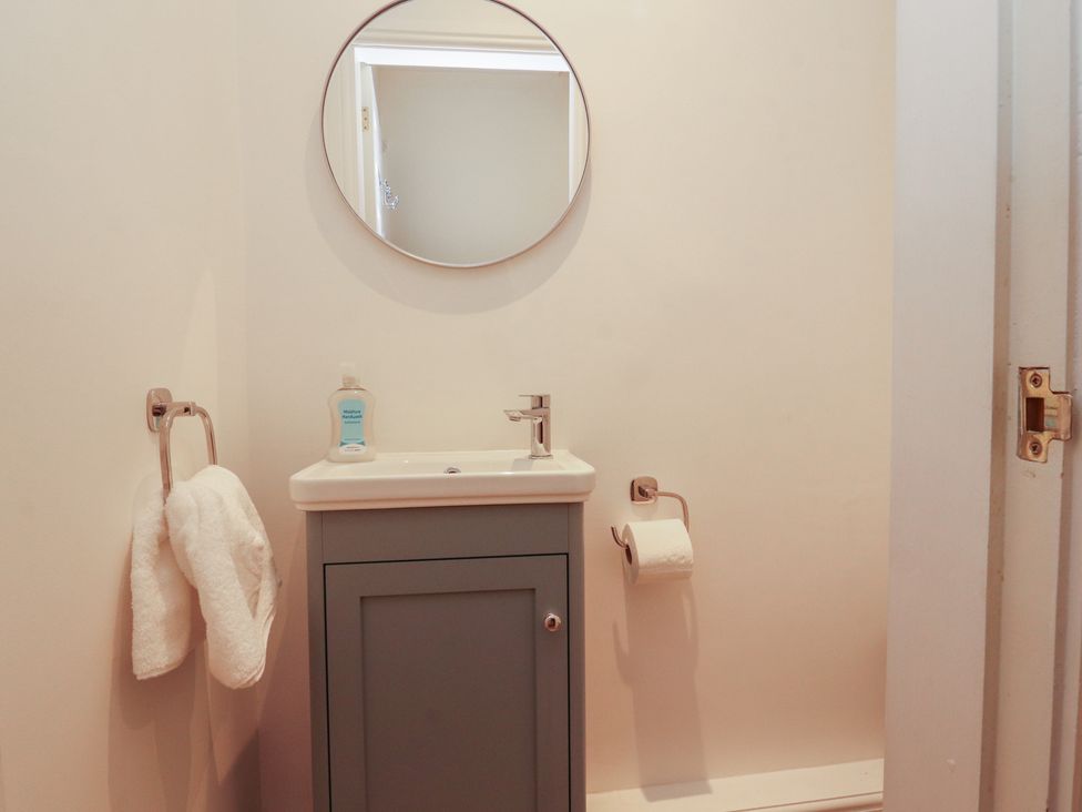 A bathroom with a sink and mirror at Silver How in Ambleside