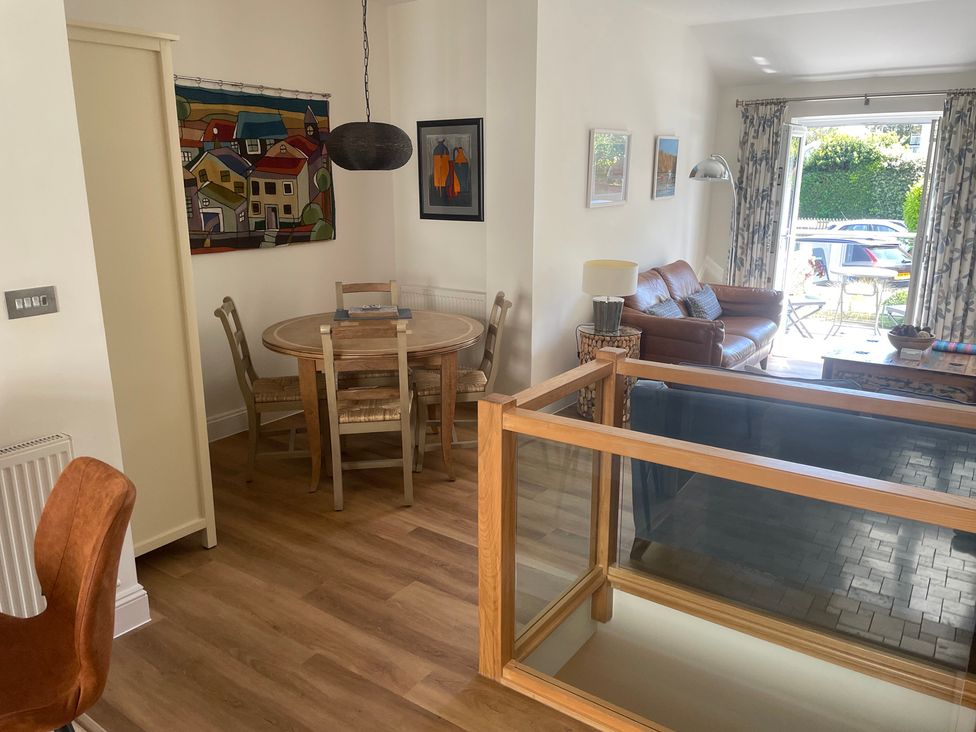 A living room with a dining area and furniture at Hamnavoe Stoke Fleming