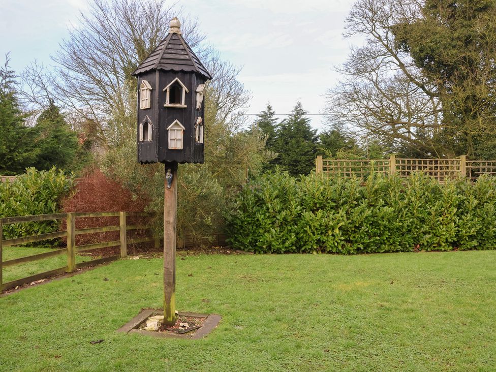 A birdhouse in a garden at Honeysuckle in Filey