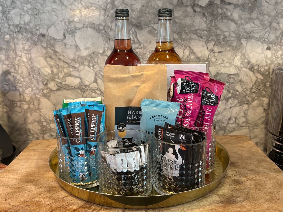 A tray with drinks and snacks in the kitchen at Astondene, East Cliff, Southwold