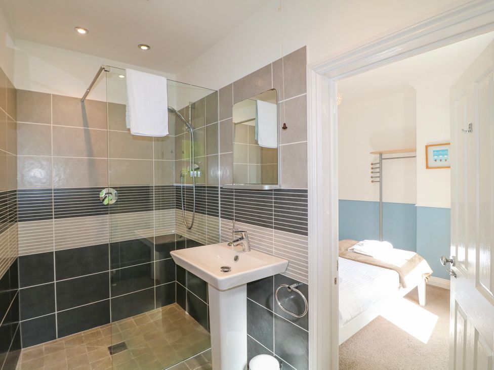 A bathroom with a shower and sink at Harbourside in Dartmouth