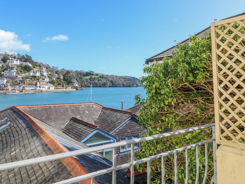 A view of houses and water from a balcony at Harbourside in Dartmouth