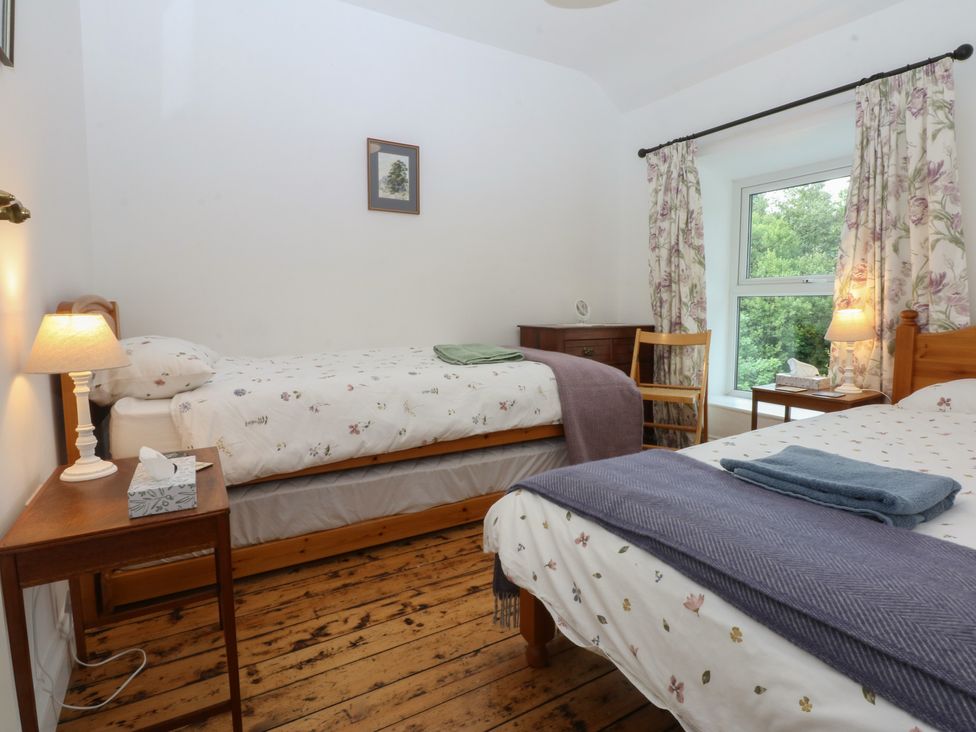 A bedroom with two beds and a window at Chandos in Dolwyddelan
