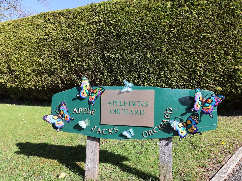A sign with butterflies at Applejacks Orchard in Holywell