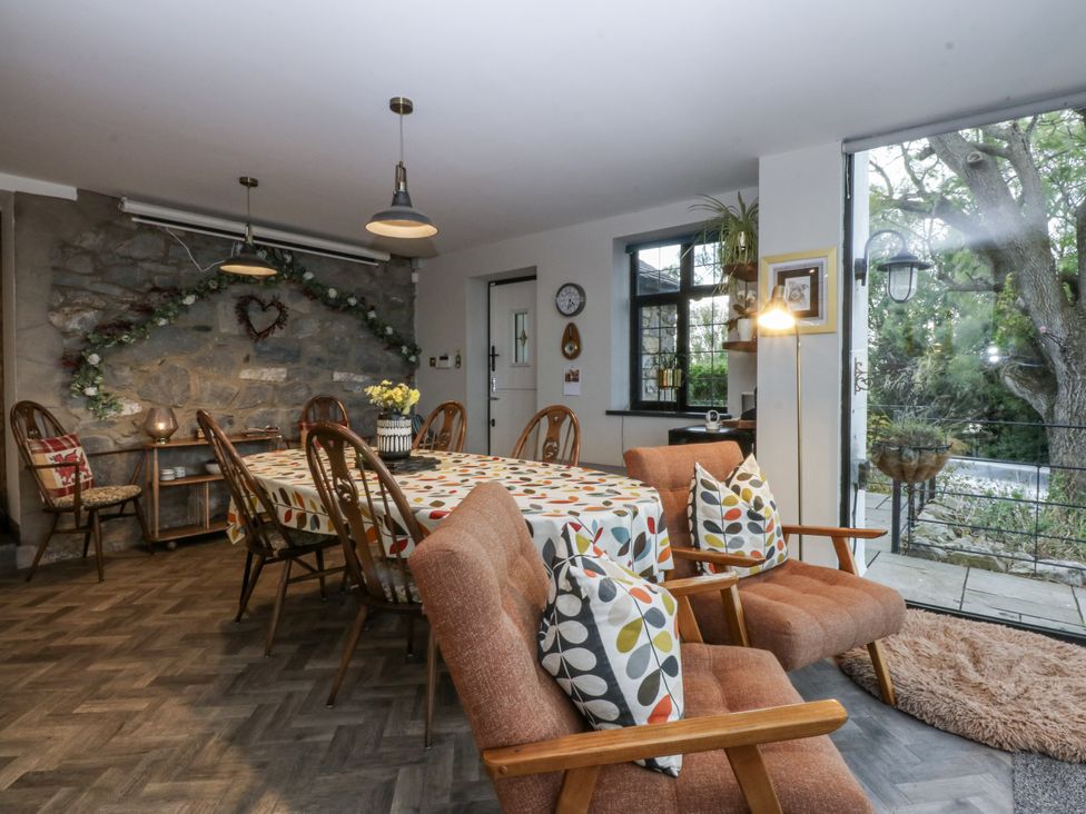 A dining room with a large table and chairs at Windyridge in Gwaenysgor, near Prestatyn