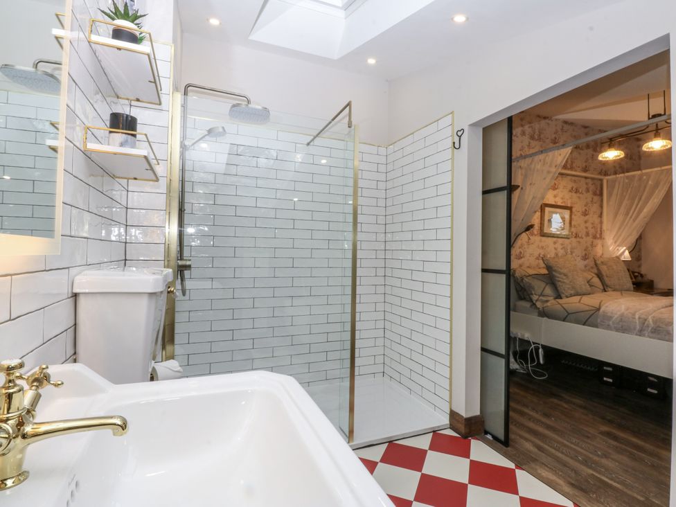 A bathroom with a shower and sink at Windyridge in Gwaenysgor, near Prestatyn