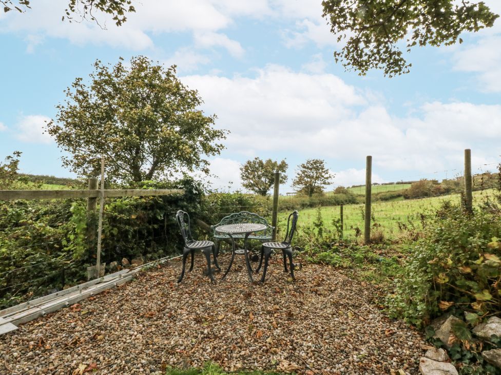 A table and chairs set in a garden at Windyridge in Gwaenysgor, near Prestatyn