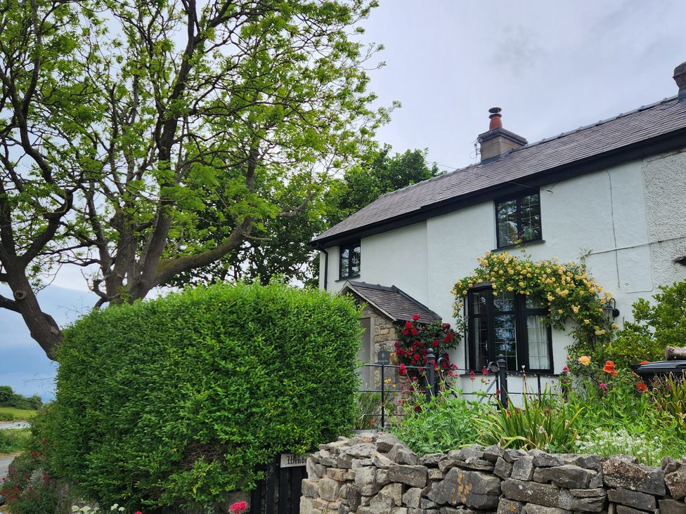 A house with a garden and trees at Windyridge in Gwaenysgor, near Prestatyn