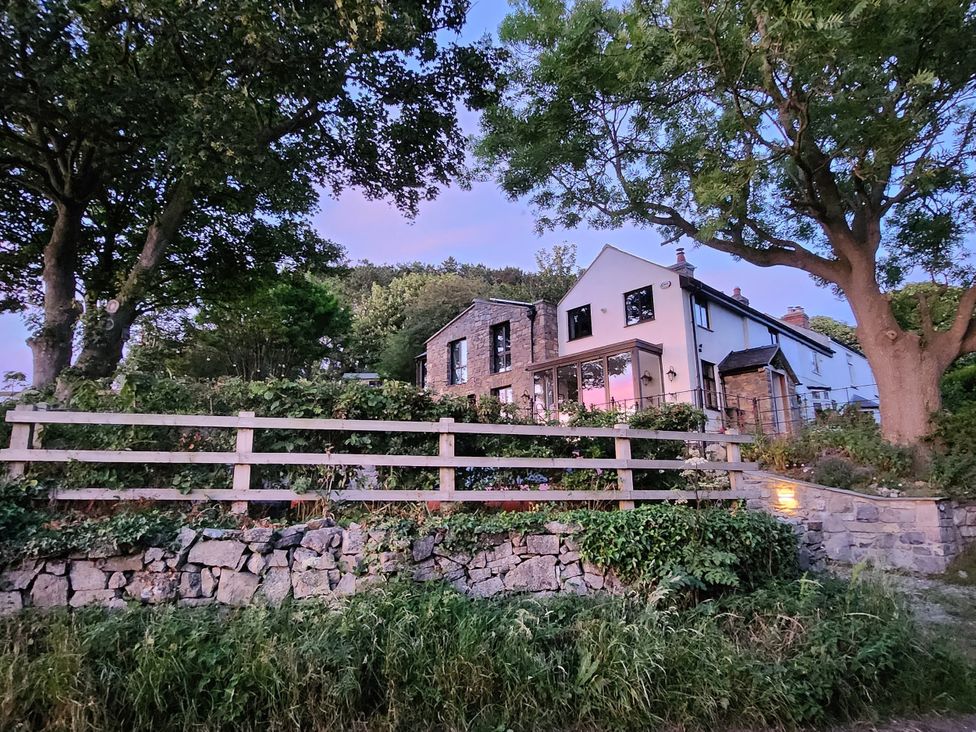 A house with a garden and stone wall at Windyridge, Gwaenysgor, near Prestatyn
