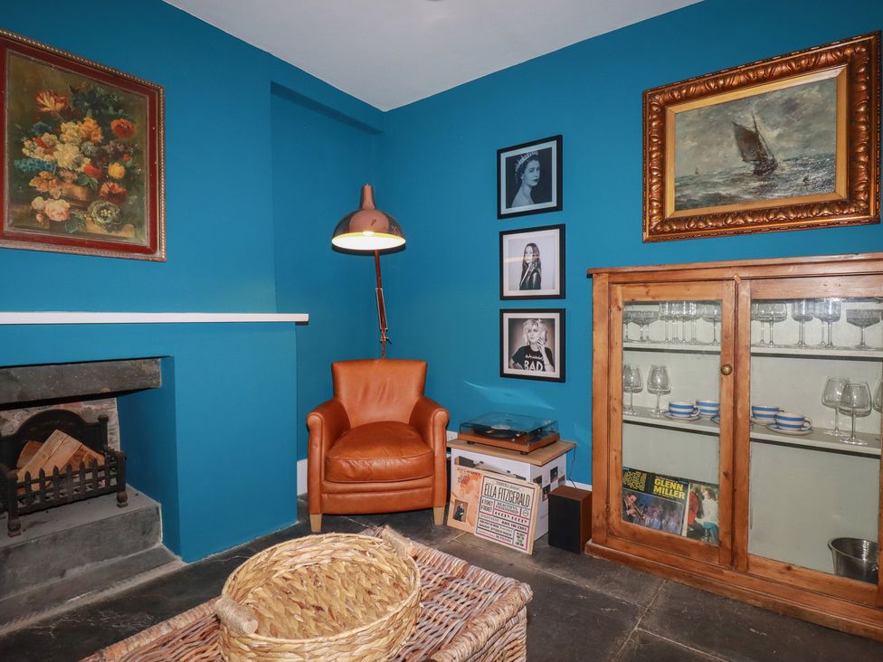 A snug with a chair and record player at 84 Fore Street