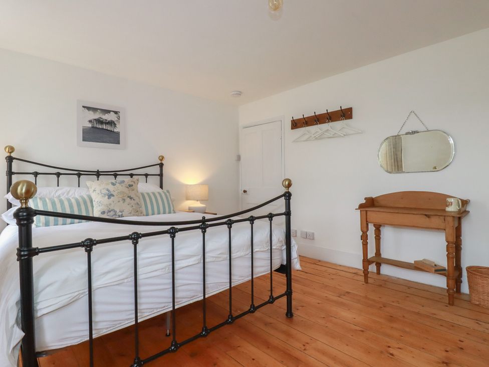 A bedroom with a bed and a table at 84 Fore Street